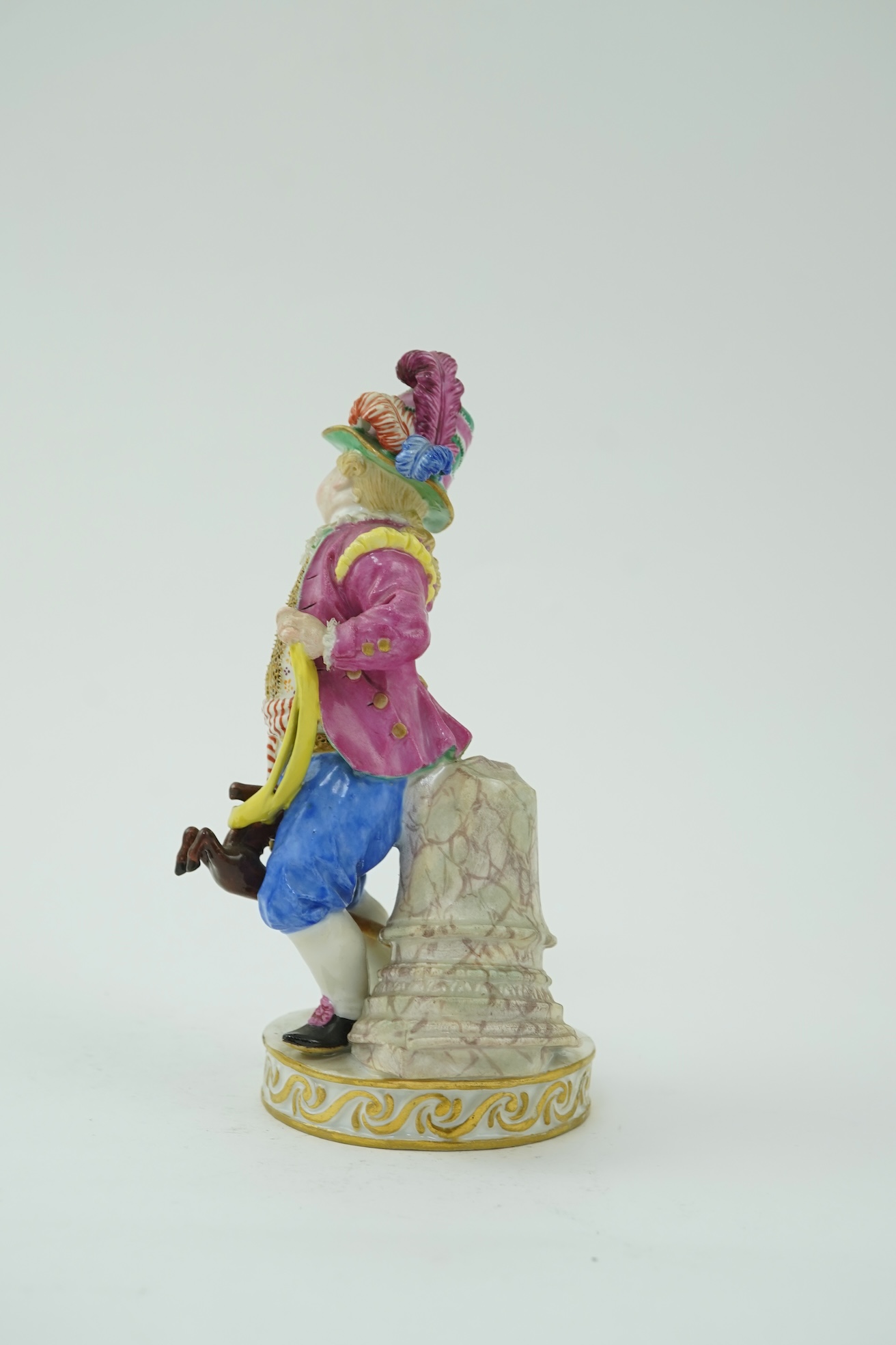 A Meissen figure of a boy on a hobby horse, 19th century